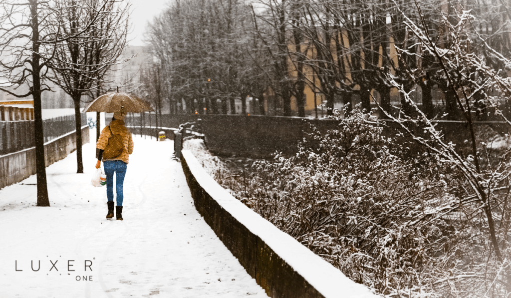 Resident walking on snowy pathway in the winter