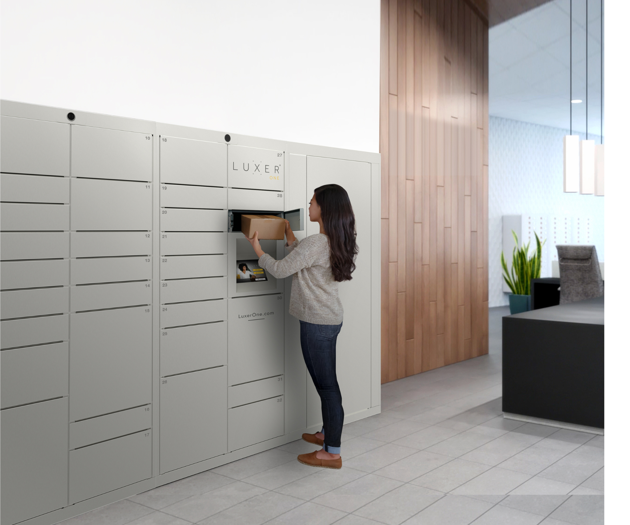 Staffer collecting package from smart locker in lobby