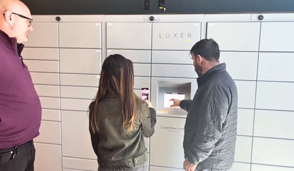 Luxer One employees supporting a property manager to educate them on their Luxer One locker system