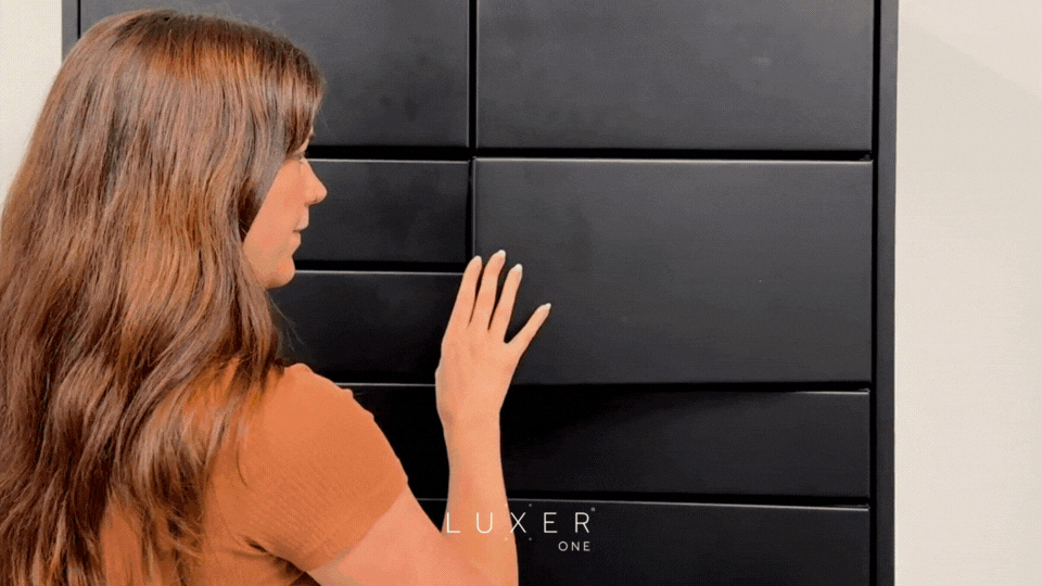 Woman picking up takeout order through food pickup lockers from Luxer One