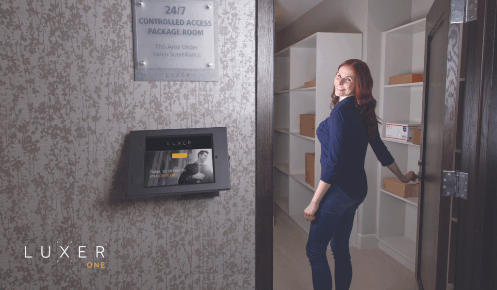 Woman opening the door to the automated package room from Luxer One