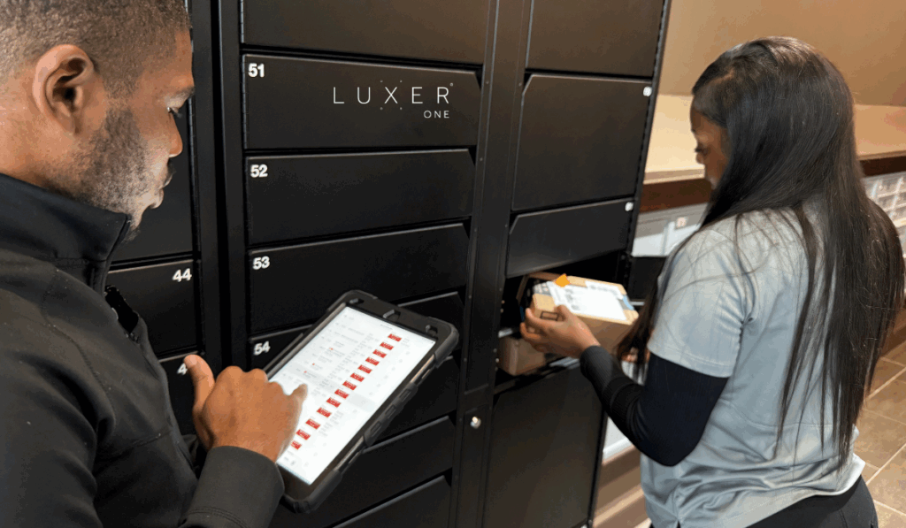 Luxer Liaisons performing an audit on a Luxer One smart package locker to ensure the system is working properly
