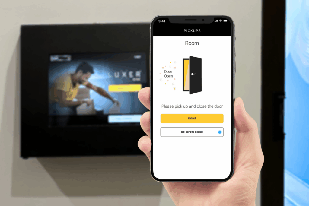 Resident using Luxer One mobile app to open the smart package room