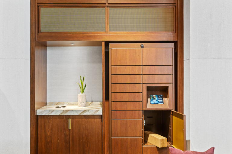 Wooden wrapped smart lockers with door open revealing package inside