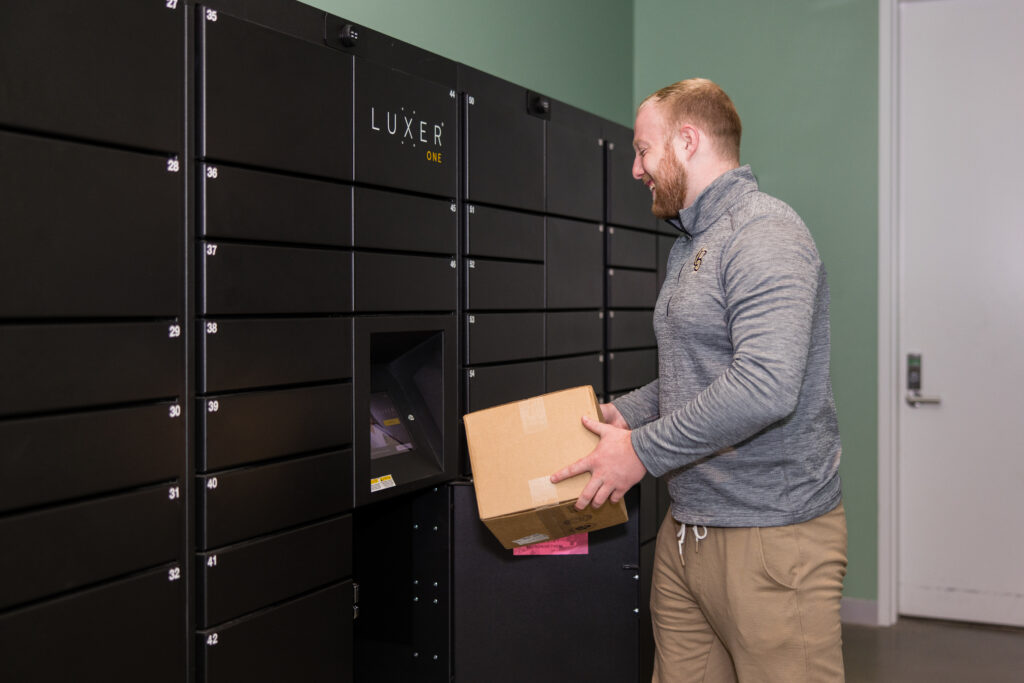 university student getting package from smart locker
