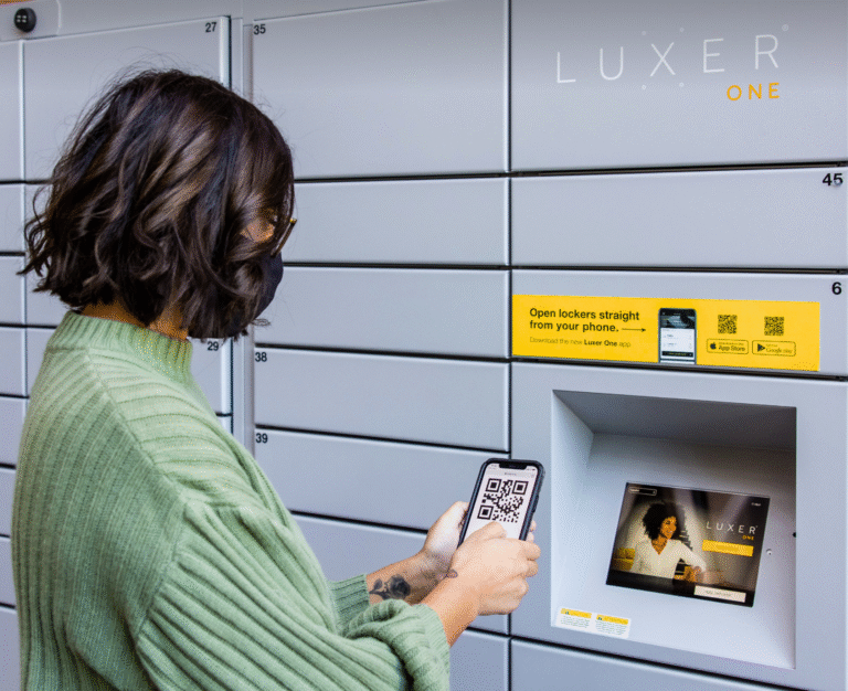 student picking up package from smart locker