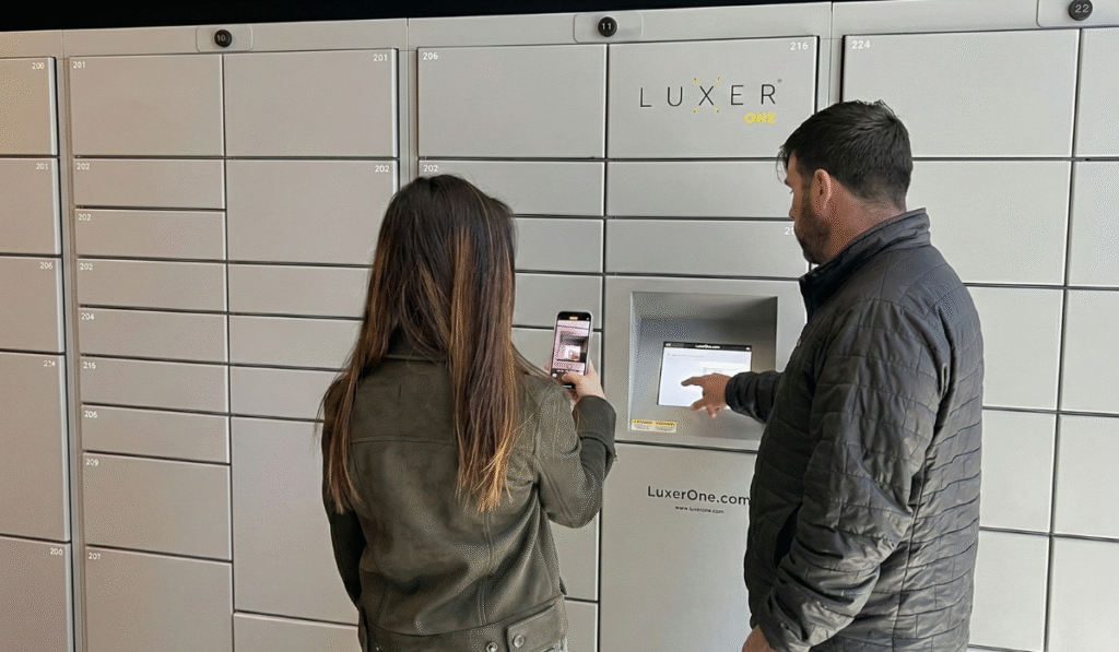 Luxer One employee teaching a property manager how to use the smart package lockers at their community