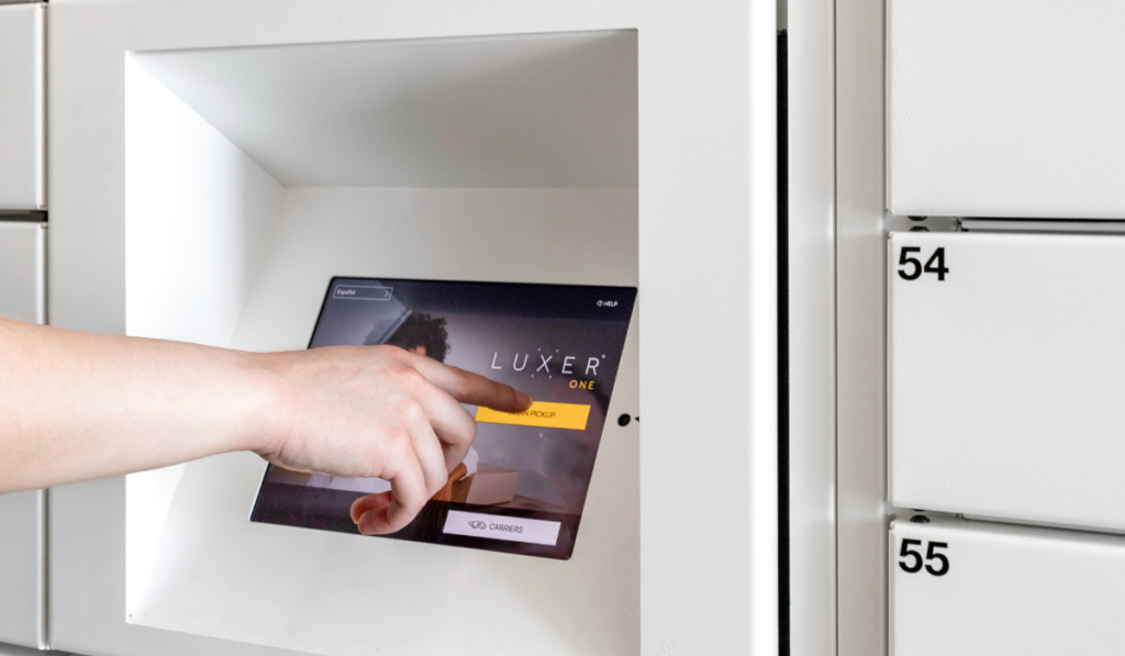 Resident using the touchscreen to get their package from the Luxer One smart package lockers