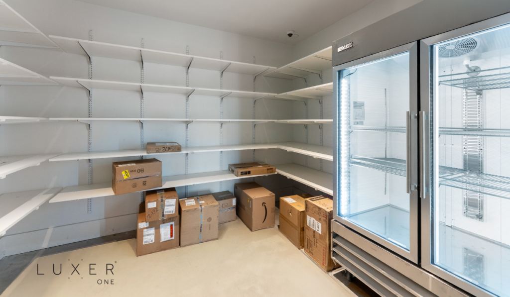 Tidy, smart package room with fridge in multifamily community