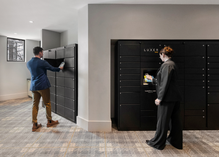 Residents using black Luxer One package lockers at 704 at the Quarter in Charlotte, NC