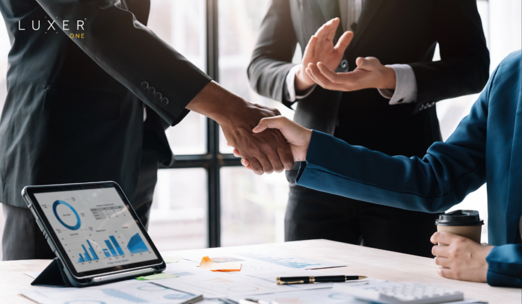 Merger agreement with professionals shaking hands
